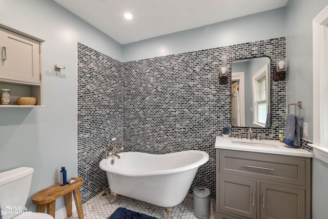 1435 Kensington Ave, Grosse Pointe Park, MI 48230 - full bath featuring vanity, a freestanding tub, tile walls, and tile patterned floors
