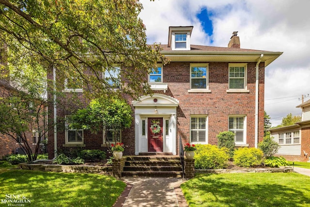 1435 Kensington Ave, Grosse Pointe Park, MI 48230 - colonial house featuring a front yard, brick siding, and a chimney