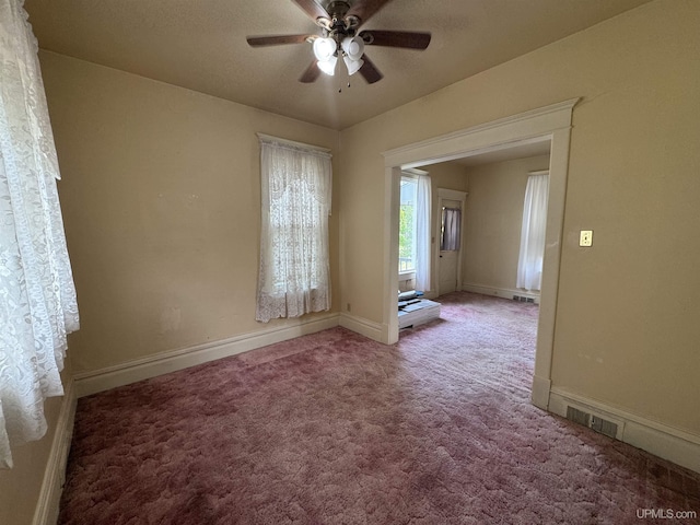 406 S 12th St, Escanaba, MI 49829 - carpeted spare room with ceiling fan and baseboards