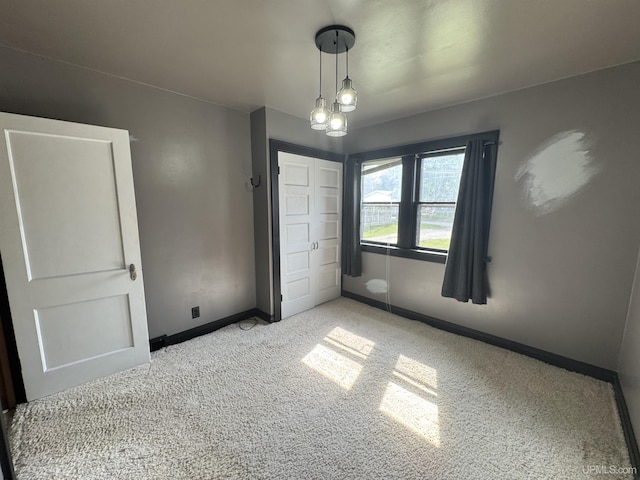 406 S 12th St, Escanaba, MI 49829 - unfurnished bedroom with carpet and a closet