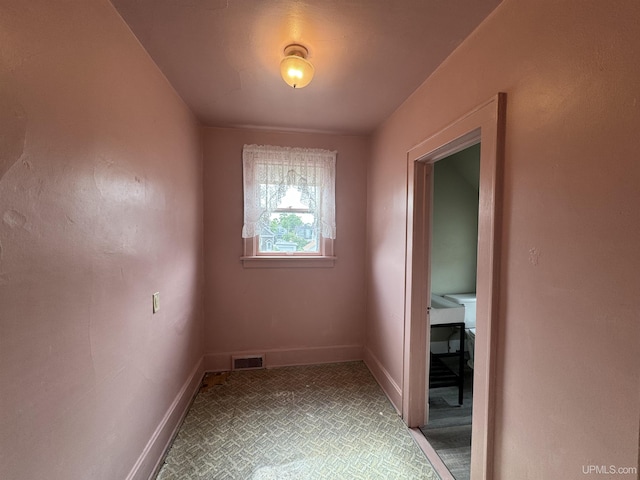 406 S 12th St, Escanaba, MI 49829 - empty room featuring baseboards and carpet flooring