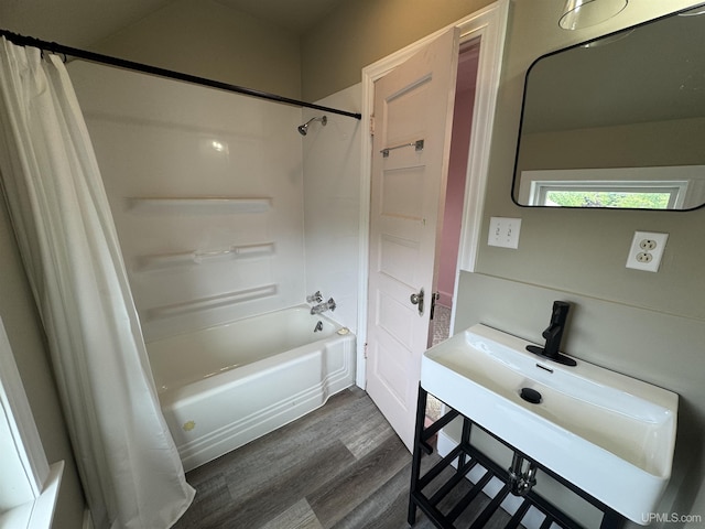 406 S 12th St, Escanaba, MI 49829 - bathroom featuring shower / bath combination with curtain, wood finished floors, and vanity