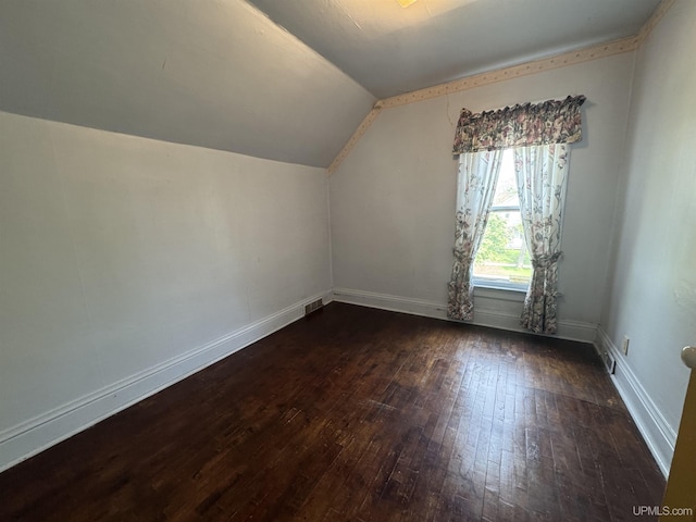406 S 12th St, Escanaba, MI 49829 - bonus room with dark wood-style floors and lofted ceiling