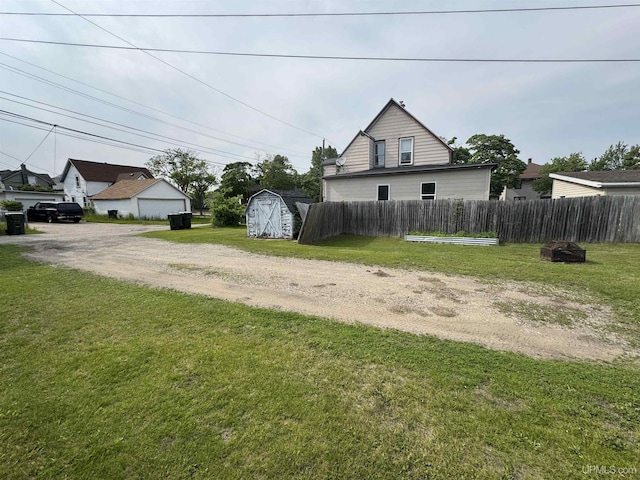 406 S 12th St, Escanaba, MI 49829 - view of home's exterior featuring a storage shed