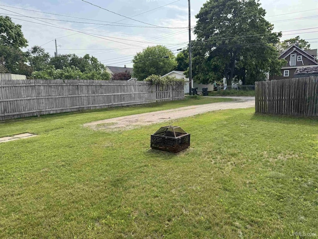 406 S 12th St, Escanaba, MI 49829 - view of yard with a fire pit