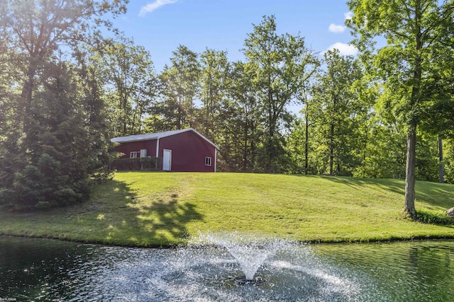 6767 Puttygut Rd, East China, MI 48054 - view of green lawn with an outbuilding, a water view, and an outdoor structure