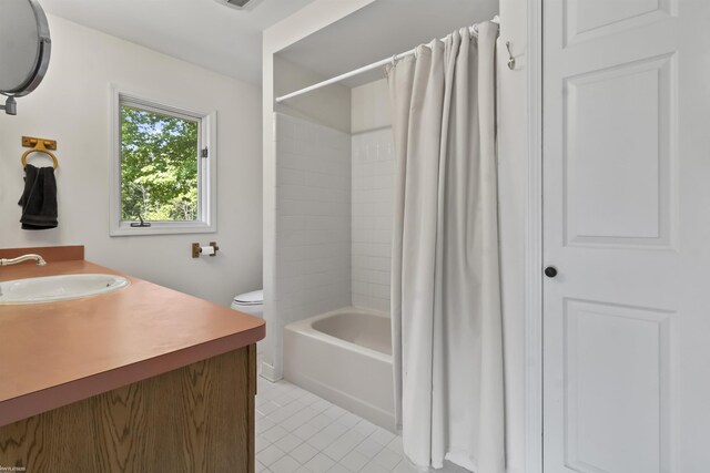 6767 Puttygut Rd, East China, MI 48054 - full bathroom featuring tile patterned floors, vanity, and shower / tub combo with curtain