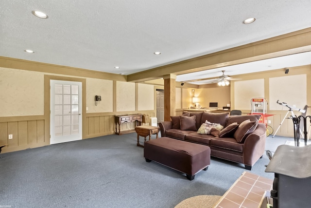 6767 Puttygut Rd, East China, MI 48054 - carpeted living area featuring a textured ceiling, wainscoting, recessed lighting, and ceiling fan