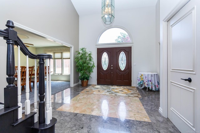 31595 N River Rd, Harrison Twp, MI 48045 - entrance foyer with a towering ceiling, marble tiled floors, a chandelier, and stairs