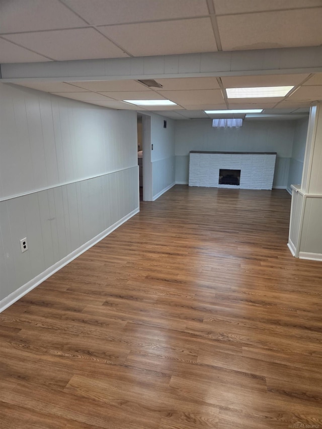 23018 Englehardt Cmn, Saint Clair Shores, MI 48080 - finished basement with a fireplace, wood finished floors, and a drop ceiling