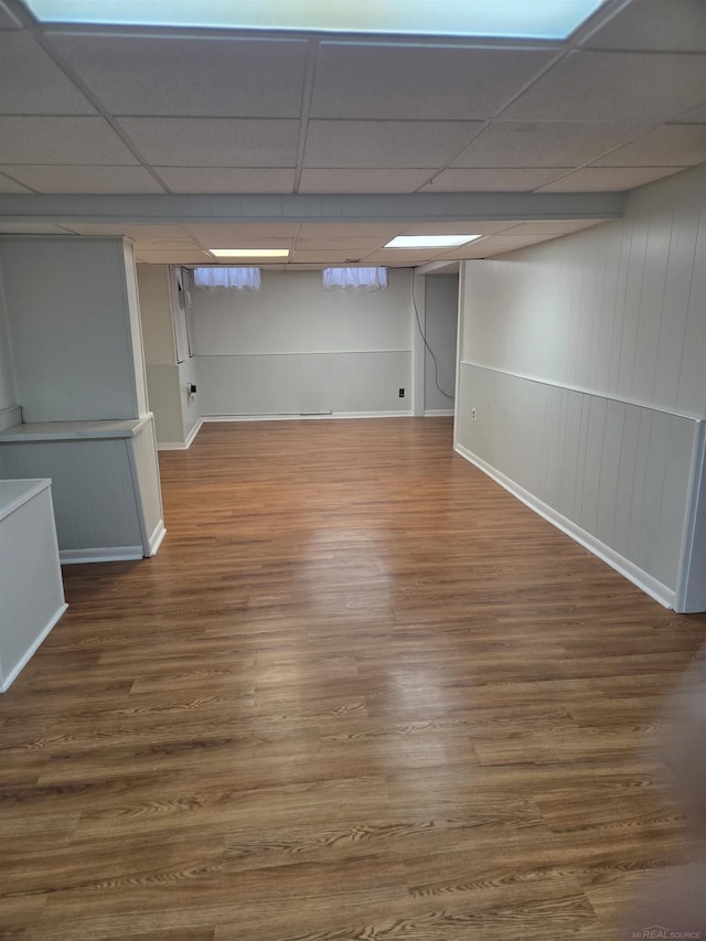 23018 Englehardt Cmn, Saint Clair Shores, MI 48080 - finished below grade area with a paneled ceiling, wood finished floors, and a decorative wall