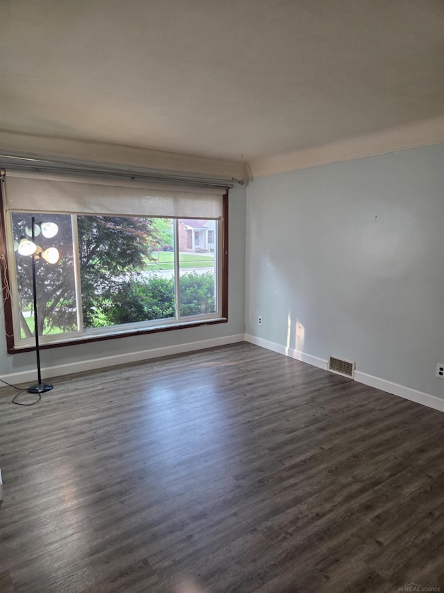 23018 Englehardt Cmn, Saint Clair Shores, MI 48080 - empty room with dark wood finished floors