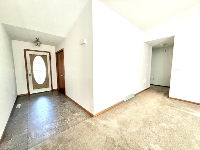 1248 S Hemlock Rd, Hemlock, MI 48626 - carpeted foyer with vaulted ceiling