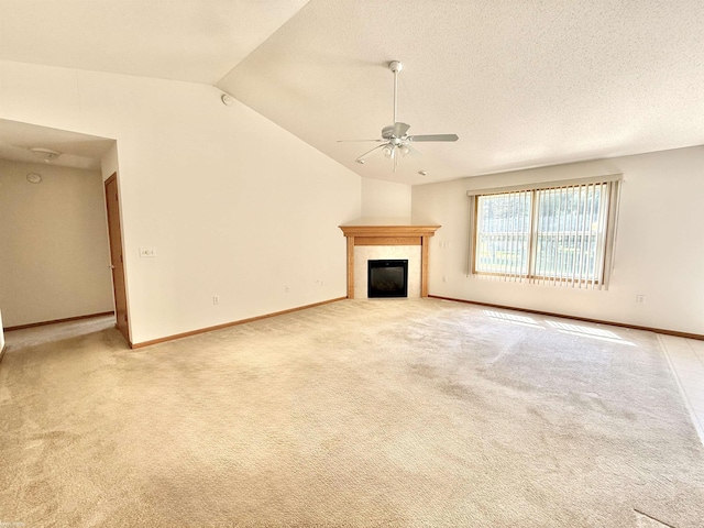 1248 S Hemlock Rd, Hemlock, MI 48626 - unfurnished living room featuring ceiling fan, vaulted ceiling, a fireplace, light carpet, and a textured ceiling