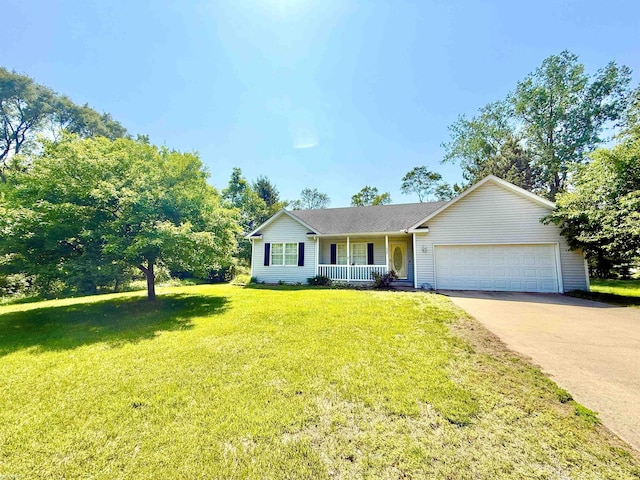 1248 S Hemlock Rd, Hemlock, MI 48626 - single story home with a porch, an attached garage, concrete driveway, and a front lawn
