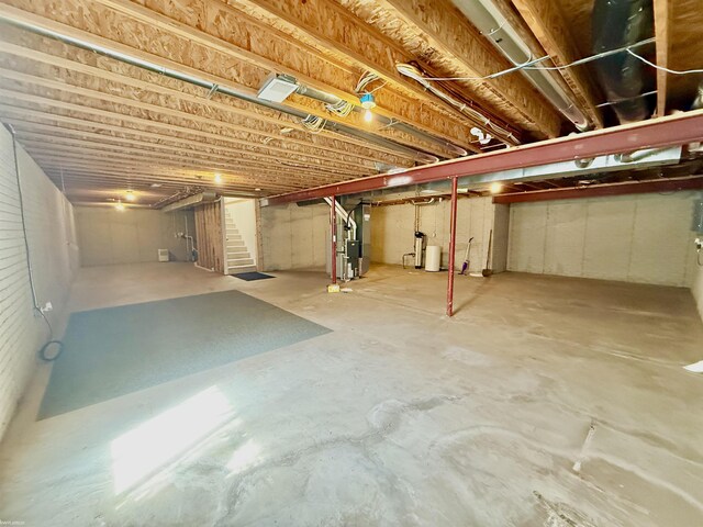 1248 S Hemlock Rd, Hemlock, MI 48626 - unfinished below grade area with stairs and heating unit