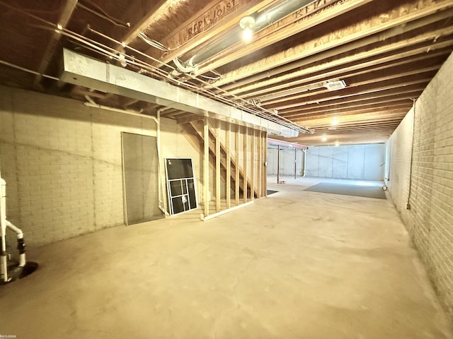 1248 S Hemlock Rd, Hemlock, MI 48626 - unfinished basement with brick wall