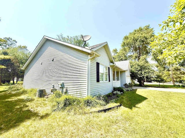 1248 S Hemlock Rd, Hemlock, MI 48626 - view of property exterior featuring a yard and a central air condition unit