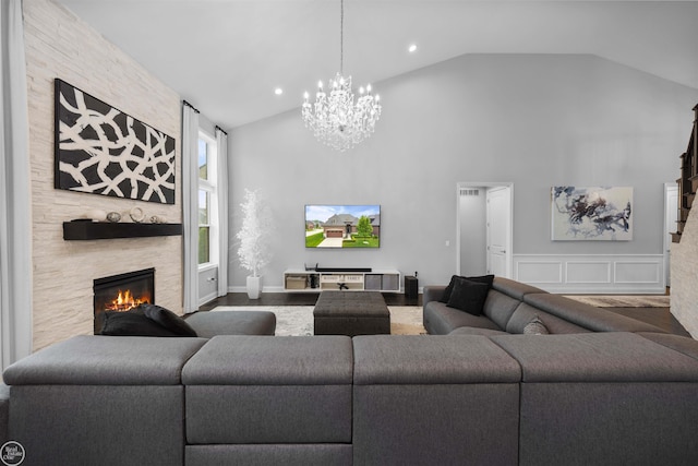 53081 Enclave Cir, Shelby Twp, MI 48315 - living room with a chandelier, a large fireplace, high vaulted ceiling, and recessed lighting