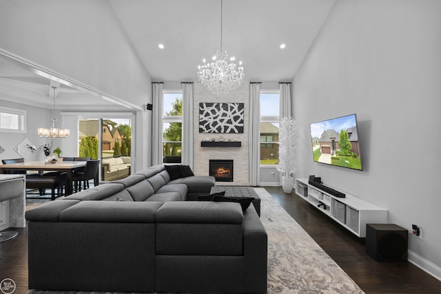 53081 Enclave Cir, Shelby Twp, MI 48315 - living area featuring a chandelier, a fireplace, plenty of natural light, dark wood-style flooring, and recessed lighting
