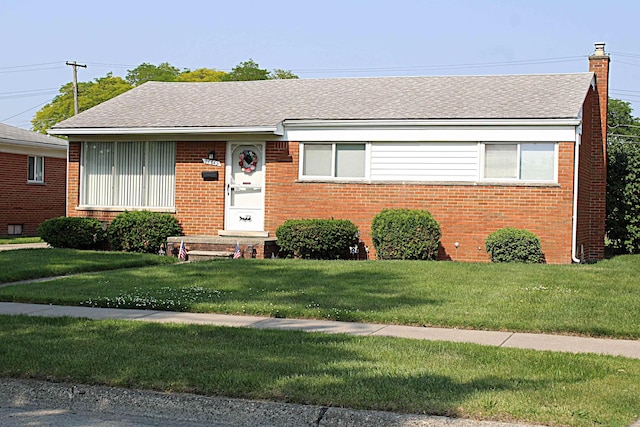 24849 Curie St, Warren, MI 48091 - view of front of home with brick siding and a front lawn