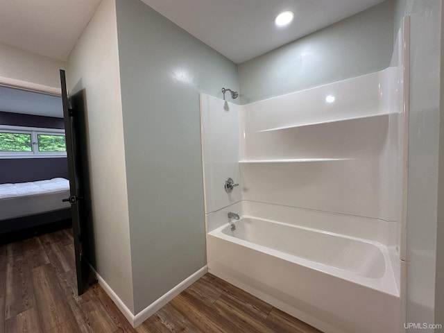 708 Paul Bunyan Ave, Ontonagon, MI 48853 - ensuite bathroom featuring wood finished floors, shower / bath combination, and recessed lighting