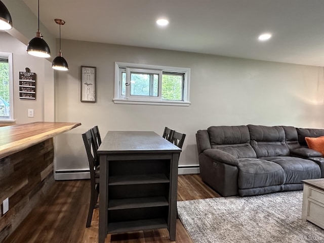 708 Paul Bunyan Ave, Ontonagon, MI 48853 - dining room featuring baseboard heating, dark wood-style floors, and recessed lighting