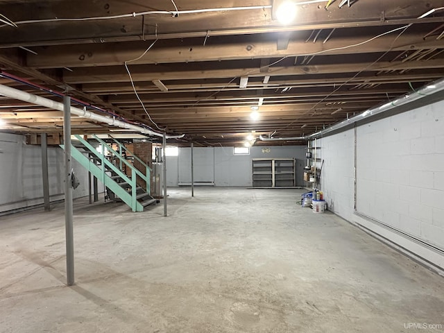 708 Paul Bunyan Ave, Ontonagon, MI 48853 - unfinished basement featuring stairway