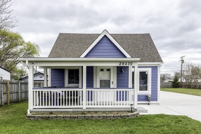 29230 Harding St, Roseville, MI 48066 - view of front facade with a porch, roof with shingles, and concrete driveway