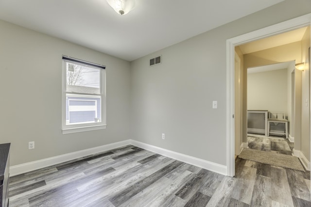 29230 Harding St, Roseville, MI 48066 - spare room featuring wood finished floors and baseboards