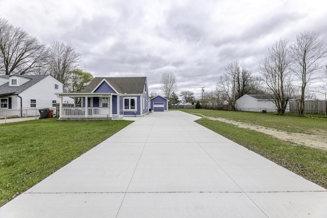 29230 Harding St, Roseville, MI 48066 - view of front of home with a porch, an outdoor structure, and a detached garage