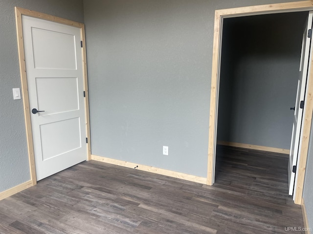 227 W Birch St, Ironwood, MI 49938 - unfurnished room featuring wood finished floors and baseboards