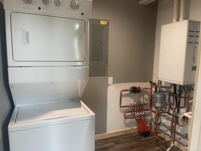 227 W Birch St, Ironwood, MI 49938 - laundry room featuring stacked washer / dryer, water heater, wood finished floors, electric panel, and a textured wall