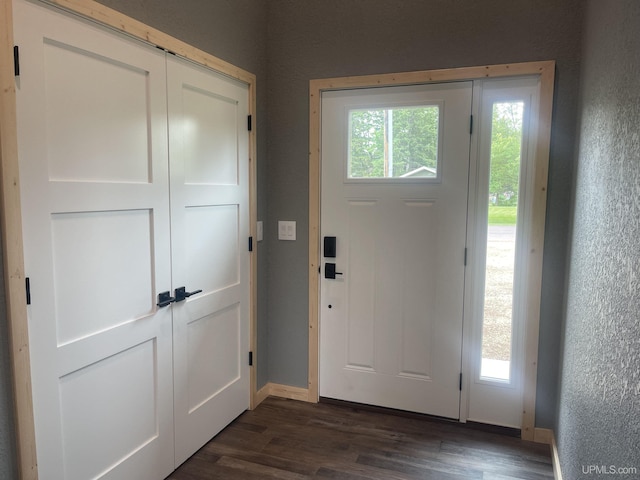 227 W Birch St, Ironwood, MI 49938 - entryway featuring dark wood-type flooring and a textured wall