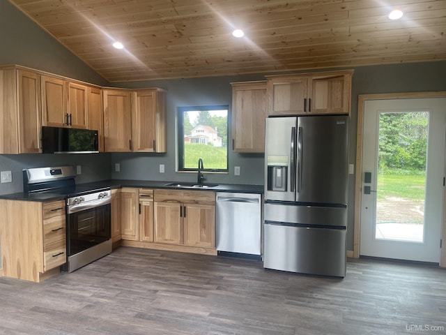 227 W Birch St, Ironwood, MI 49938 - kitchen with appliances with stainless steel finishes, wooden ceiling, dark countertops, healthy amount of natural light, and wood finished floors