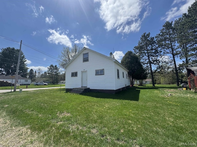 301 Kahma Ave, Amasa, MI 49902 - view of side of home featuring a lawn