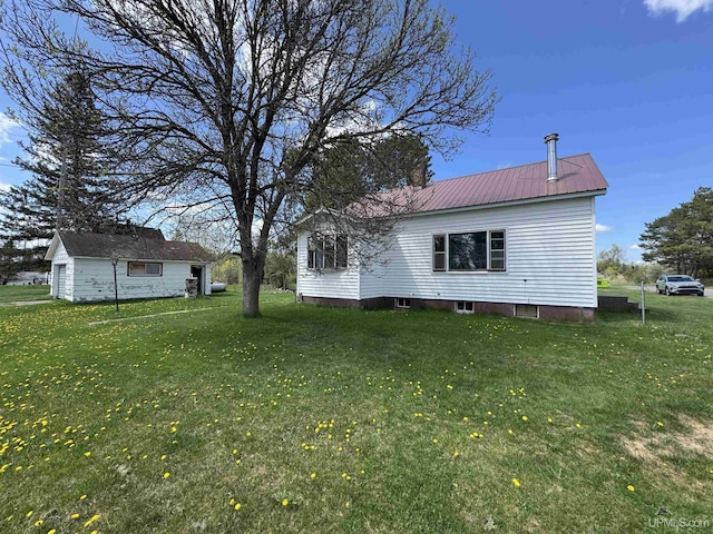 301 Kahma Ave, Amasa, MI 49902 - view of property exterior featuring a yard and a metal roof