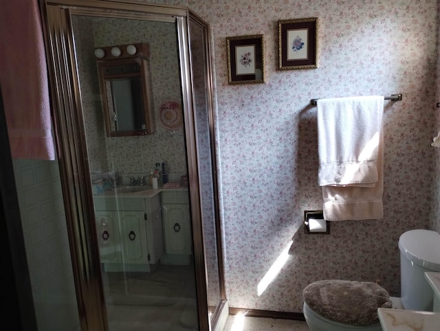 11131 Kaylynn Dr, Lake, MI 48632 - bathroom featuring wallpapered walls, a stall shower, and vanity