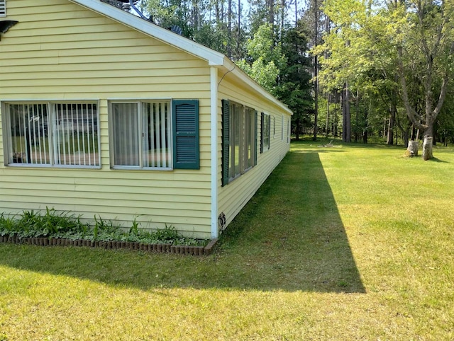 11131 Kaylynn Dr, Lake, MI 48632 - view of home's exterior with a lawn