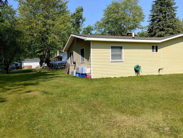 11131 Kaylynn Dr, Lake, MI 48632 - view of home's exterior featuring a yard