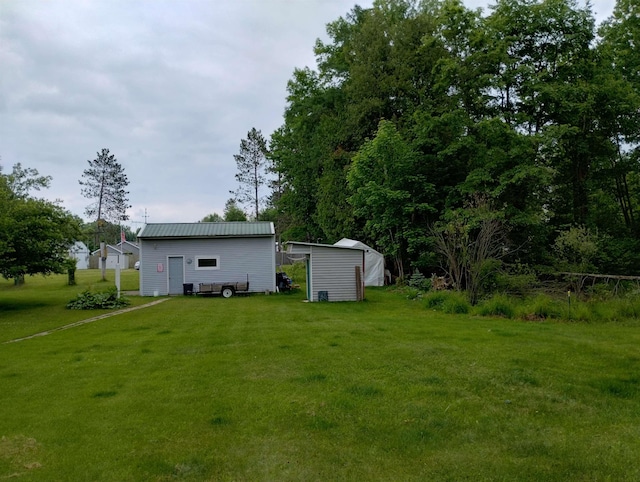 11131 Kaylynn Dr, Lake, MI 48632 - view of green lawn featuring an outdoor structure