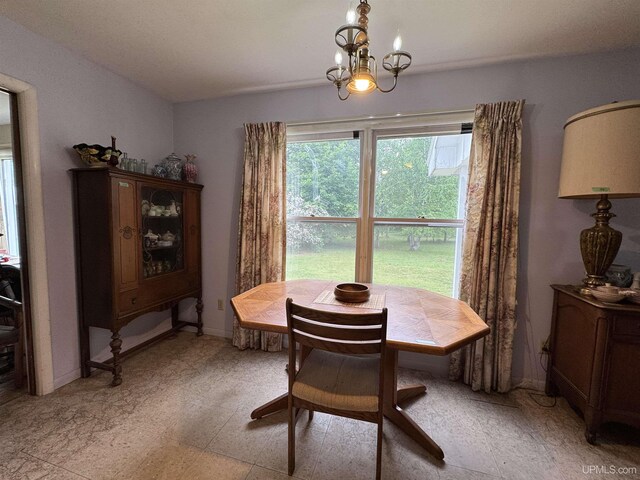 3 Fairway Dr, Marquette, MI 49855 - dining area featuring a chandelier and light flooring