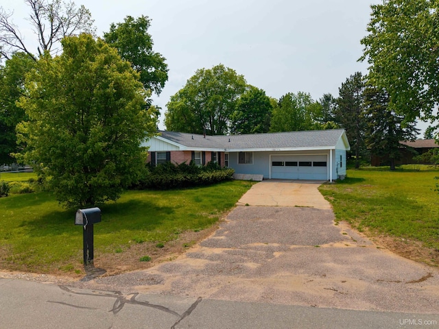 3 Fairway Dr, Marquette, MI 49855 - ranch-style house featuring an attached garage, driveway, and a front yard