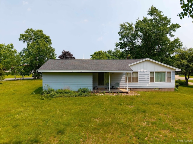 3 Fairway Dr, Marquette, MI 49855 - ranch-style house with a front lawn, roof with shingles, and board and batten siding