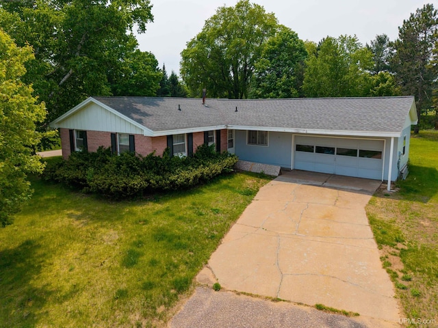 3 Fairway Dr, Marquette, MI 49855 - ranch-style house featuring an attached garage, driveway, a front yard, brick siding, and roof with shingles