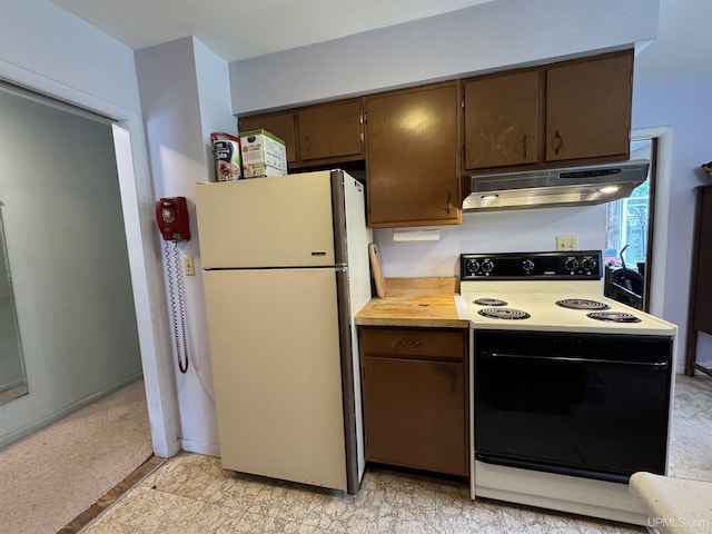 3 Fairway Dr, Marquette, MI 49855 - kitchen featuring freestanding refrigerator, range with electric cooktop, under cabinet range hood, light countertops, and dark brown cabinetry