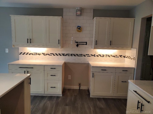 26593 Alray St, Chesterfield, MI 48051 - kitchen featuring light countertops, dark wood-style floors, backsplash, and white cabinetry