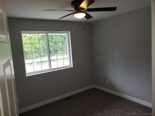 26593 Alray St, Chesterfield, MI 48051 - unfurnished room featuring a ceiling fan and dark carpet