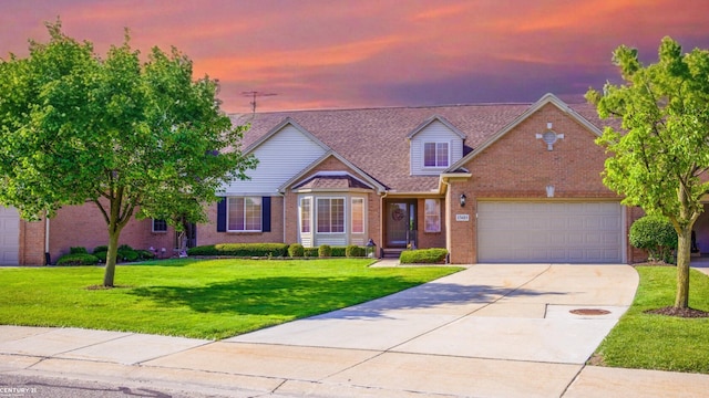 17485 Averhill Blvd, Macomb, MI 48042 - traditional home featuring brick siding, driveway, a front lawn, and an attached garage
