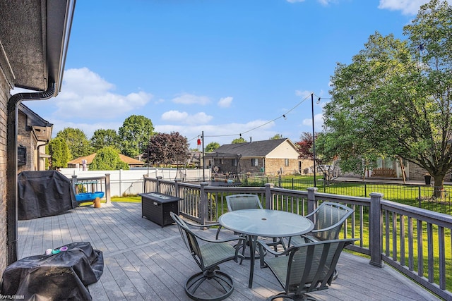 53564 Grace Dr, New Baltimore, MI 48047 - wooden deck featuring a fenced backyard and outdoor dining area